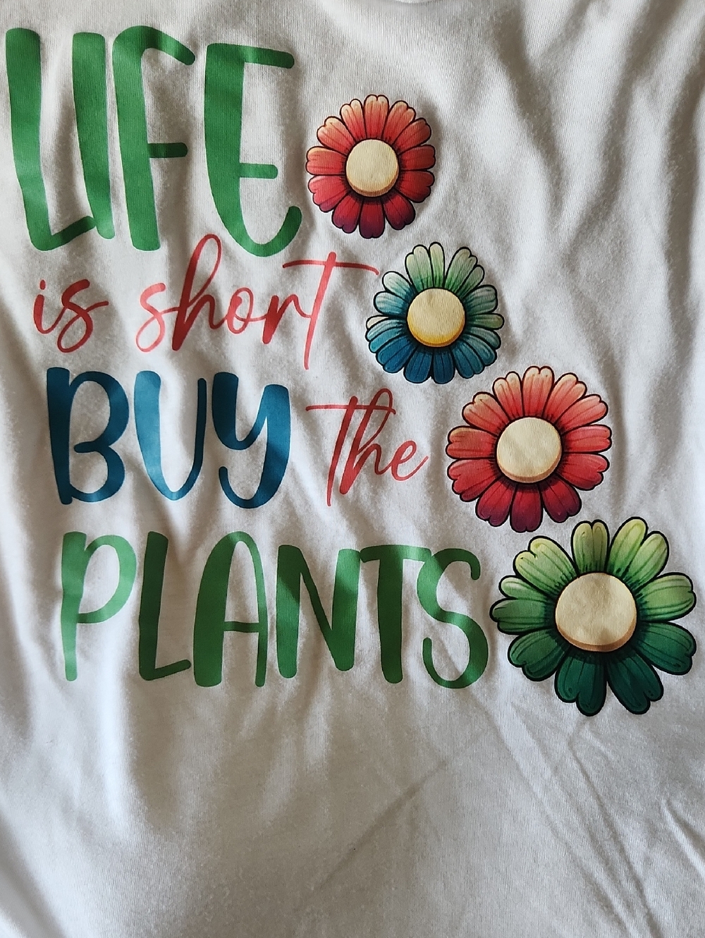 Bella Canvas White Graphic Tee with Multicolor Floral and Green Text